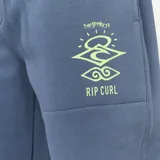 Pantalón de jogging azul con cintura elástica ajustable con cordón, bolsillos laterales y puños elásticos. Estampado con logo de Rip Curl en la pierna derecha.