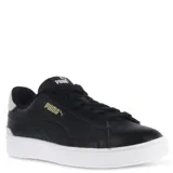 Championes urbanos Puma Serve Pro, color negro con detalles en gris y logo dorado, confeccionados en cuero sintético con suela blanca.
