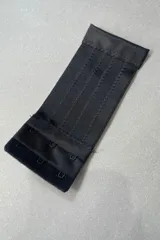 Extensor de contorno de soutien negro con tres ganchos, 15 cm de largo por 6 cm de ancho.