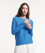 Blusa de punto Marfinno color menta con textura ondulada, cuello redondo y mangas largas.