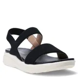 Sandalias de mujer con tiras elásticas negras y base de goma blanca con diseño texturizado.