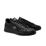 Championes urbanos de cuero negro con logo de cocodrilo verde bordado en el lateral.