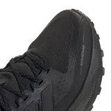 Championes de running Adidas modelo Ultrarun 5 TR, color negro. Presentan un diseño técnico con malla superior repelente al agua, mediasuela con tecnología Bounce 2.0 para mayor amortiguación y suela de goma Adiwear con tracción optimizada para diversos terrenos.