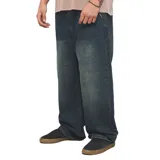 Pantalón de jean Quiksilver modelo Skater Ollie, color azul oscuro con efecto desgastado, de corte amplio y relajado tipo baggy.