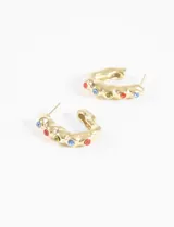 Aros dorados de acero quirúrgico hipoalergénico con forma de medialuna irregular y strass de colores.