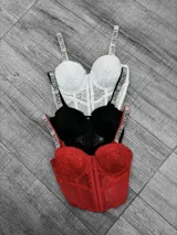 Top corset con copas preformadas y encaje, con cierre frontal y tirantes ajustables con la inscripción "Love Secret" en strass.