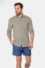 Short de baño azul con microestampado de kitesurf, cintura elastizada y cordón ajustable.