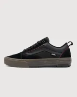 Championes Vans modelo Skate Old Skool Wafflecup, color negro con suela de goma color marrón. Presentan construcción Wafflecup para mayor durabilidad y soporte, con detalles en color bordó en la parte superior y el icónico diseño de la marca.