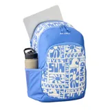 Mochila Rip Curl modelo Ozone 2.0 de 30 litros, color azul con estampado blanco de estilo surf/floral que incluye texto como "SUN", "WAVES" y "RIP CURL". Presenta un compartimento principal y un bolsillo frontal con cierre.