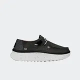 Zapatillas Hey Dude modelo Wendy Peak Chambray de lona color negro, con suela de plataforma elevada blanca y detalles de costuras y cordones elásticos.
