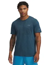 Remera deportiva Under Armour de manga corta, confeccionada en tejido de punto suave con diseño jaspeado en tonos azules. Presenta zonas de ventilación con malla estratégica y construcción prácticamente sin costuras para mayor comodidad durante el entrenamiento.