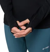 Buzo deportivo de manga larga con cierre frontal parcial y cuello alto. Cuenta con tecnología de absorción de humedad y protección solar, costuras ergonómicas y orificios para los pulgares en los puños.