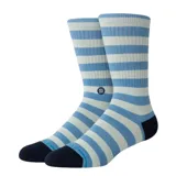 Medias de caña alta Stance modelo Breton Crew, con diseño de rayas horizontales en celeste y gris claro, talón y puntera negros, y pequeño logo bordado en el lateral.