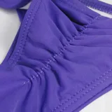 Bombacha de bikini colaless para mujer, de diseño plisado en la parte trasera y tiro bajo, disponible en varios colores.