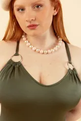 Malla entera azul con breteles finos y espalda cruzada.