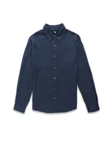 Camisa de manga larga color verde menta, de corte recto y confeccionada en tejido de lino y algodón. Tiene cuello clásico, cierre frontal con botones de madera y logo bordado en el pecho. Ideal para verano.