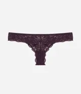 Bombacha tipo bikini hilo confeccionada en encaje con diseño floral, presenta un detalle de moña en la parte central de la cintura y laterales medianos.