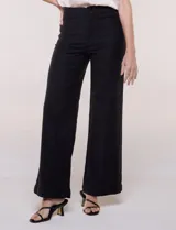 Jean wide leg de tiro alto marca Dictionary, color negro, con pretina con pasadores, botón, cierre y bolsillos delanteros y traseros.