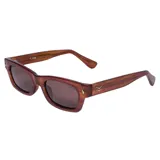 Lentes de sol I-Sea modelo Flynn, con armazón rectangular de acetato en tono marrón traslúcido y micas oscuras.
