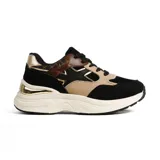 Sneaker de mujer con plataforma gruesa color crema, diseño chunky y combinaciones de colores negro, beige, marrón con estampado animal print y detalles metálicos dorados en el talón y laterales.