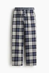 Pantalón largo a cuadros en tonos azul marino, blanco y marrón, con cintura elástica y detalle de botones frontales.