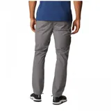 Pantalón de estilo utilitario color gris, confeccionado en tejido elástico con paneles reforzados. Presenta bolsillos laterales, bolsillos traseros, bolsillo de seguridad con cremallera y dobladillo ajustable con ceñidor.