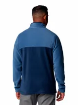 Buzo polar de fleece con diseño de medio cierre frontal con botones a presión. Presenta un diseño bicolor en tonos azul, con cuello alto y logo de la marca bordado en el pecho.