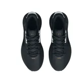 Championes de básquet Under Armour modelo Lockdown 6, color negro con detalles en blanco y logo dorado con efecto desgastado en el lateral. Presentan suela con patrón de tracción texturizado en blanco y negro.