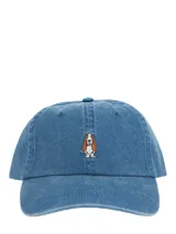 Gorra tipo baseball de algodón orgánico con efecto lavado, color azul, con bordado central de un perro Basset Hound y ajuste posterior con hebilla.