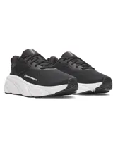 Championes de running Under Armour modelo W Rogue 6, color negro con suela blanca. Presentan parte superior de malla ligera y transpirable con superposiciones de TPU, entresuela Charged+ para mayor absorción de impactos y suela de goma.
