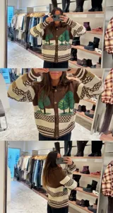 Cardigan de punto con diseño artesanal de paisaje boscoso, cuello polo y cierre frontal con botones metálicos. Presenta un patrón de franjas horizontales en tonos marrón, crema y detalles en beige, con mangas largas y puños acanalados.