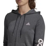 Campera Adidas Essentials de mujer color gris con cierre frontal y capucha con cordón ajustable. Logo de Adidas estampado en el pecho y letras verticales en la manga izquierda.