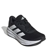 Championes de running Adidas Galaxy 7 W para mujer, con diseño en color negro y detalles en blanco. Presentan un empeine de malla textil resistente, cierre con cordones y mediasuela con tecnología Cloudfoam para una amortiguación superior y una pisada suave.