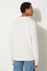 Sweater verde oscuro de punto trenzado con cuello redondo y logo Carhartt WIP bordado en rosa en el pecho.