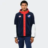 Campera de polar azul marino con capucha, cierre frontal y detalles en rojo. Presenta mangas con paneles blancos, logo de Umbro bordado y escudo del Club Nacional de Football.