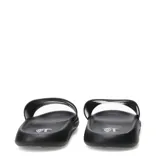 Sandalia tipo slide Umbro, color negro, con banda ancha superior que presenta el logo de la marca en relieve.