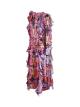 Vestido largo con estampado abstracto en tonos rosa, amarillo, negro y celeste. Presenta cuello redondo con volados y mangas largas con puños elásticos.