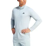 Remera de entrenamiento Adidas color celeste con cierre parcial y logo en el pecho.