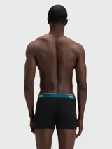 Pack de tres bóxers ajustados de algodón, color negro, con cintura elástica en contraste color azul petróleo y logo de la marca estampado en blanco.