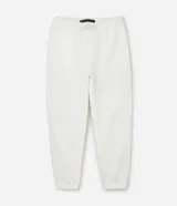 Pantalón jogger negro de algodón y poliéster, con cintura elástica y cordón ajustable. Presenta bolsillos laterales y puños ajustados en los tobillos.