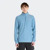 Buzo deportivo New Balance de manga larga, color celeste jaspeado (space dye), con cuello alto y cierre frontal de un cuarto. Presenta el logo de New Balance en el pecho.