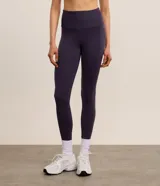 Calza legging deportiva Get Over en poliamida de color azul oscuro, con cintura alta y diseño liso.