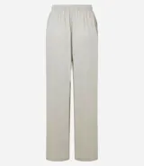 Pantalón de corte holgado y fluido, color negro, con cintura elástica y lazo ajustable. Confeccionado en una mezcla de viscosa y lino.
