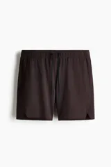Short deportivo de tejido funcional con tecnología DryMove para absorción de sudor. Presenta corte estándar, cintura elástica con cordón de ajuste, bolsillos laterales al bies, un bolsillo con cierre y aberturas en el bajo.