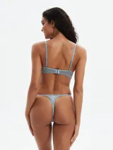 Tanga de encaje color celeste con estampado de cebra en tonos grises.