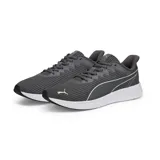 Championes Puma Transport Modern Running color gris, con detalles en blanco y suela blanca.