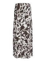 Pollera larga de corte recto confeccionada en tejido mesh con estampado animal print tipo vaca en tonos blanco y marrón oscuro. Presenta cintura elastizada y diseño fluido.