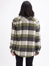 Sobrecamisa de corte holgado con estampado de cuadros en tonos azul, blanco y marrón. Presenta cierre frontal con botones, cuello clásico, bolsillos en el pecho y un interior forrado en sherpa color beige.