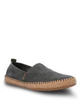 Alpargatas Hush Puppies modelo Hubert, color negro, con suela de yute trenzado y costuras decorativas. Diseño slip-on con elástico en el empeine.