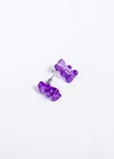 Par de aros con forma de ositos de goma color violeta.